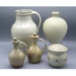 A Winchcombe Pottery cream ground jug, height 21cm and a similar garlic jar, height 9.
