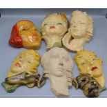 Six Art Deco style plaster wall masks, modelled as lady's, largest length 30.5cm.