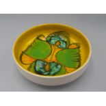 A Poole pottery bowl, the yellow ground with abstract designs, diameter 17.5cm.