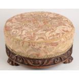 A carved walnut circular footstool, 19th century,