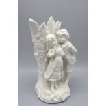 A Parian ware figural spill vase, with a young courting couple, height 20cm.