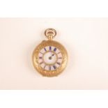 An 18ct gold cased half hunter keyless fob watch with a pink and blue enamel chapter ring.