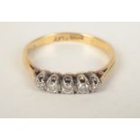 An 18ct gold ring set a row of five small diamonds. Condition report: Weight 2.2gms.