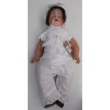 A porcelain head doll, the head with sleep eyes, open mouth,