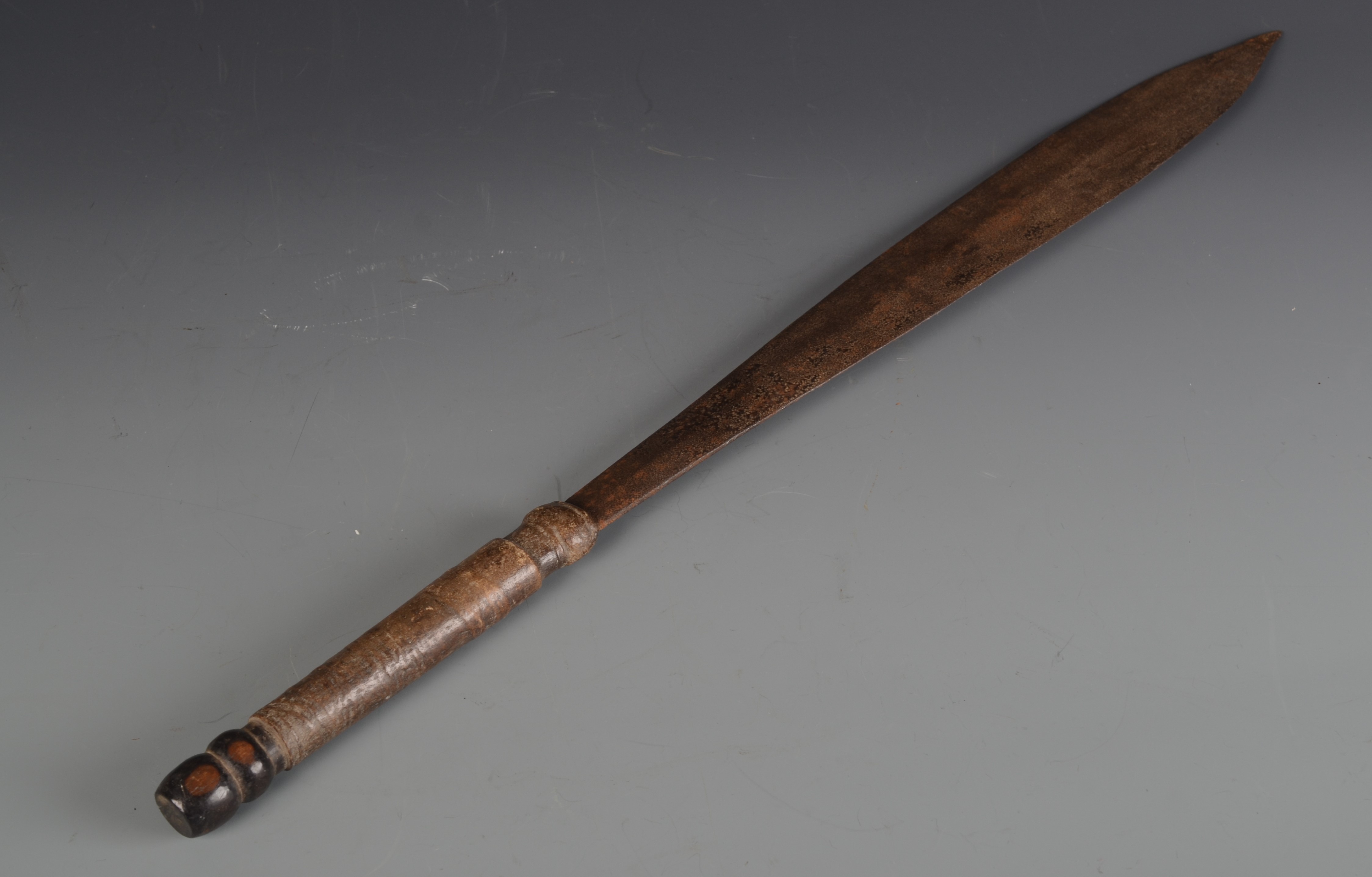 A Masai short sword, 19th century, with lignum and leather handle, length 55cm.