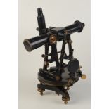 A theodolite by T Cooke & Sons, London & York black metal and brass on a three screw mount,