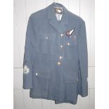 Two RAF uniforms with badges and an RAF dinner jacket and trousers.