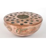 A Newlyn copper rose bowl, the pierced cover above four embossed fish, diameter 17.5cm, height 7.