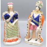 A pair of Staffordshire pottery figures,