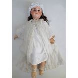 A good and large porcelain head doll by Jumeau, the porcelain head with sleep eyes, open mouth,