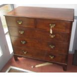 A George III oak chest of drawers,