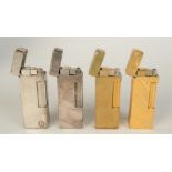 Four Dunhill Rollalite gas lighters.