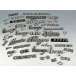 A collection of car badges including Avenger and Allegro.