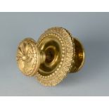 A large heavy brass door handle with acanthus leaf cast plates,
