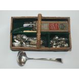 Miscellaneous silver plated flatware, including a soup ladle, in a wicker cutlery tray, length 31cm.