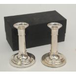 A pair of plain modern filled silver candlesticks with detachable nozzles, height 14.