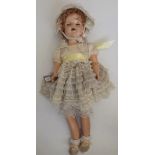 An all composition child doll, the head with sleep eyes, open mouth and teeth,