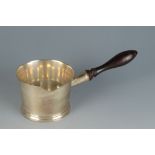 A silver brandy pan in 18th century style, London 2004. 11oz including turned wood handle.