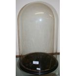 A glass dome on stand