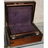 A rosewood writing box, with brass bound corners