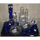 A Bohemian blue overlay glass ships decanter and six brandy balloons, together with a pair of