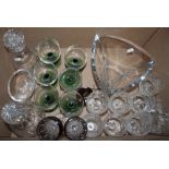 Two sets of cut glass wine glasses, together with two decanters and other glassware