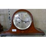 An inlaid mahogany mantel clock