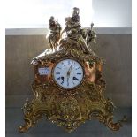 A French 19th century cast brass mantle clock, with key and pendulum