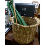 A large cane log basket, together with garden umbrella