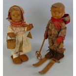 Two Goebel Hummel dolls, one of a boy entitled on tag "Ski-Maserl", with a pair of wooden skis and