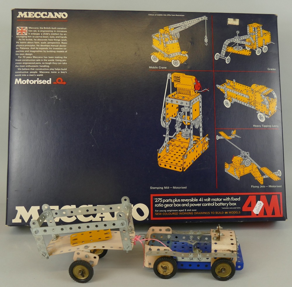 Meccano - 4M Motorised box with blue and yellow sections, various manuals etc, and a part