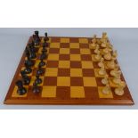 A Staunton pattern boxwood and hardwood chess set, king 9.5cm high in oak box with sliding top and a