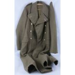 A British Army Royal Ordnance Corp great coat, size 11 dated 1953