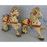 Two Mobo Pony Express pedal cart or trike horses, one with inset rear wheel and steering handle, the