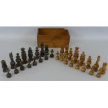 A boxwood and ebonised Regence pattern chess set, king 9cm high, in unmarked pine box lacking