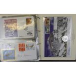 An album entitled "Royal Mail Universal", containing First Day Covers and coin covers including