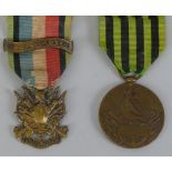 A pair of Franco-Prussian War medals, one cast as battle trophies and inscribed Oublier Jamais