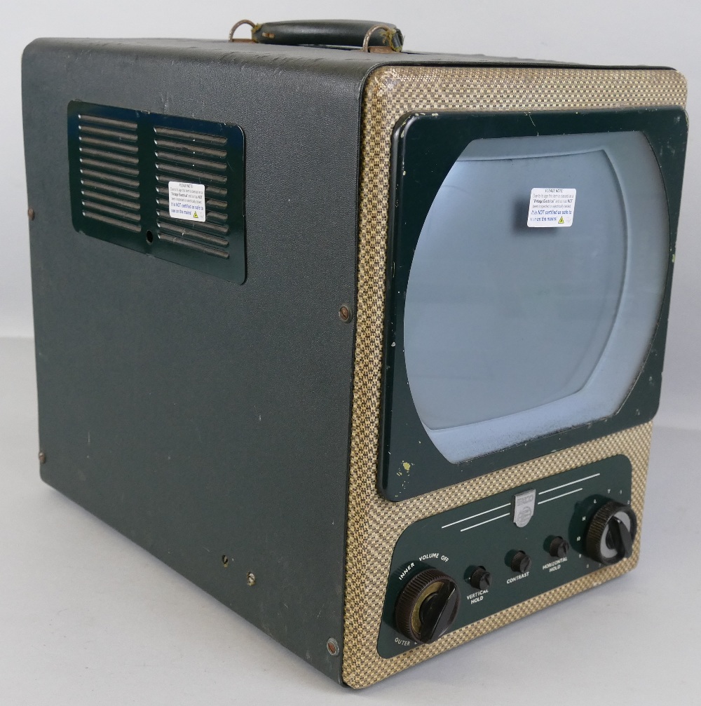 A 1950's Ekcovision Type TMB272 portable television receiver, 26cm wide, 35cm high, 40cm deep