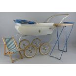 A doll's coach built pram, white painted with blue vinyl hood and cover, tubular handle and four