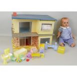 A Mettoy tin-plate contemporary style doll's house, with hinged flat roof, two ground floor rooms