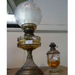 A brass oil lamp with glass shade, together with a part oil lamp (2)