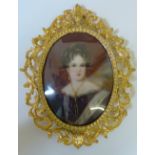 An oval portrait miniature, of a late 19th century lady, gilt frame, 8cm x 6cm