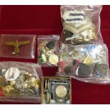 A quantity of military metal and cloth badges, archery presentation medals, modern crowns and