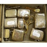 An Edwardian silver vesta case, Birmingham 1907, four other silver vesta cases and other items