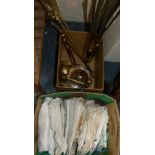 A quantity of linen, together with various metal ware including stair rods, shell case and