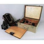 A WWII Bubble Sextant Mark 1X, in wall hanging bakelite case, serial no.17468/40 23cm high and a