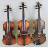 Three early to mid-20th century Czechoslovakian violins, comprising two full size, one bearing label