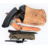 A Kalashnikov AK47, stitched leather magazine case with three (ex.4) empty magazines, together