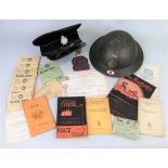 A WWII Auxiliary Fire Service steel helmet, named to Charles Batte No.132980 with cloth badge for