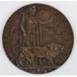 A WW1 bronze memorial plaque, for John William Tennant. John William Tennant was a crew member on